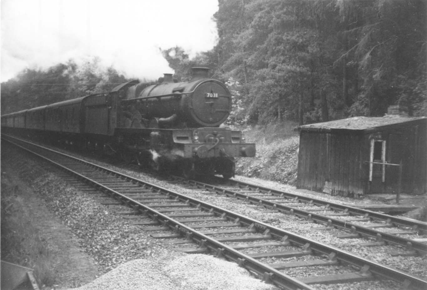 7031 is climbing Chipping Campden Bank with the evening Paddington service on Sunday 26th May 1963 and is just about to enter the tunnel.