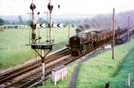 Vol 15: 92228 heading iron ore empties northbound past the 'new' yard at Honeybourne