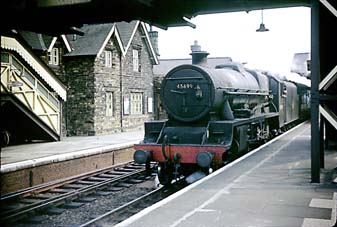 The now preserved 45699 'Galatea' is about to depart Craven Arms for Shrewsbury on 26th May 1964 after working over the Central Wales line from Pontardulais.