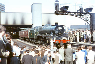 The Health & Safety Police wouldn't allow it today - as enthusiasts throng around 45647 at Leeds City on 12th July 1964.