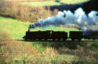 Taken by the main road just east of the closed Comins Coch Halt, 75071 ascends Talerddig Bank with the evening up mail train in the spring of 1966.