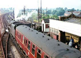 45292 is ready to depart north from Woodford Halse.  Less than 2 years before the derelict area in front of 45292 was a mass of marshalling yards for the then heavy freight traffic, complete with a large locomotive depot.