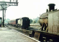 Vol 12: Prarie tanks 4157 & 4107 pass at Ross on Wye, 2nd September 1964